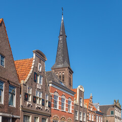 Top of fine historic buildings with a church in the background