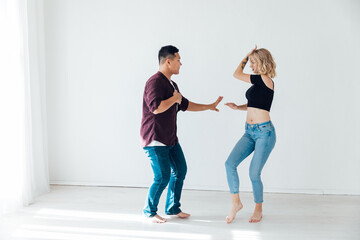 a man and a woman dance together a bachata dance to music