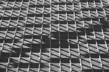 gray background, in the photo,metal lattice flooring.