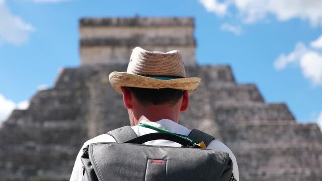 Tourist man visit Chichen Itza is a large pre-Columbian city built by the Maya people which has Mesoamerican Pyramids. The archeological site is located in Tin&uacute;m Municipality, Yucat&aacute;n State, Mexico.