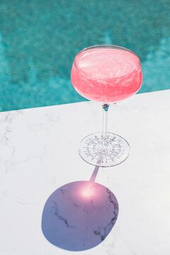 Pink Cocktail Drink by Pool