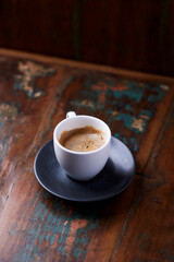 Cup of coffee on rustic wooden background. Copy space.	
