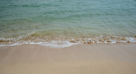 Empty sandy tropical beach. Blue water golden sand