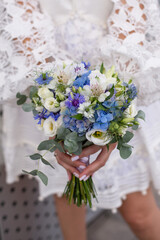 bride with flowers bouquet in the hands