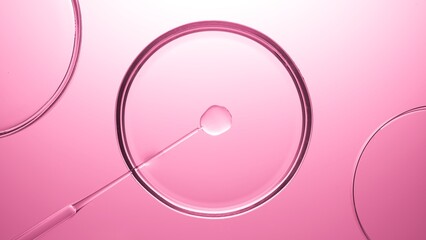 Top view macro shot of chemical dropper injects oil into clear fluid in one of three petri dishes...