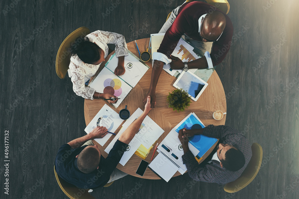 Poster adding new creative talent to their project. high angle shot of businesspeople shaking hands during 