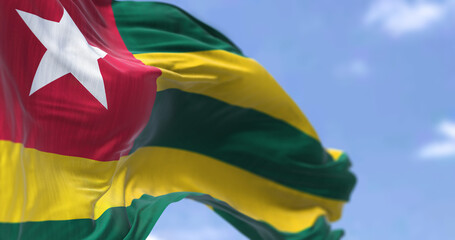 Detail of the national flag of Togo waving in the wind on a clear day