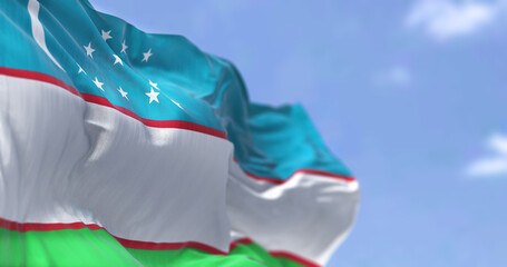 Detail of the national flag of Uzbekistan waving in the wind on a clear day