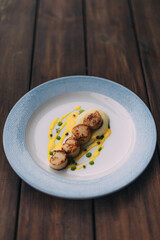 shellfish on a plate with souce