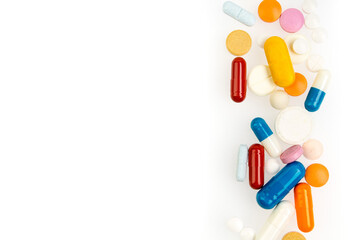 Set of different colorful pills and capsules isolated on white background. Copy space for text.
