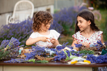 Girls make homemade lavender wreaths as a decor