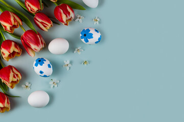 Tulip flowers and easter eggs decorated with flowers