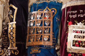 Detail view of colorfully decorated Ashkenazi Torahs (Jewish Bible) housed in an ark in a synagogue.
