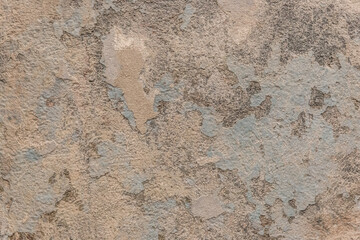 Peeling old plaster with damaged concrete wall cement weathered texture broken background