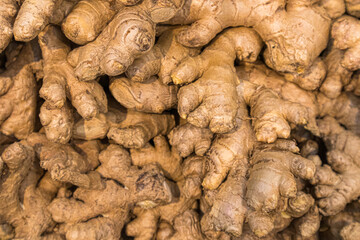 ginger root on the shelves in close-up as a background