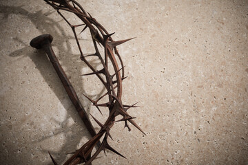 Easter concept. Crown of thorns with Nail on a stone background.