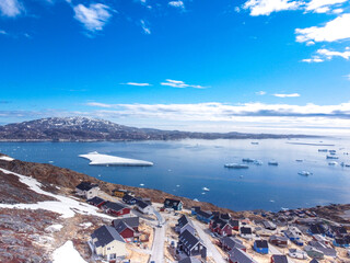 Aerial view small beautiful village over snow in Greenland Europe © watcharapas