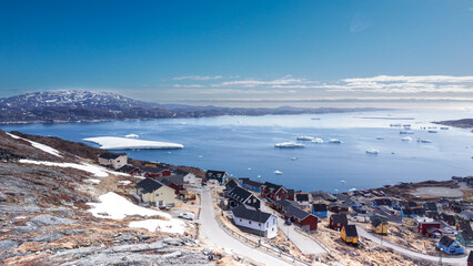 Aerial view small beautiful village over snow in Qaqortoq Greenland Europe © watcharapas