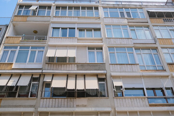 facade of a building windows and balcony. urban background