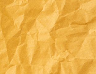 Wrinkled sheet of yellow paper. Textured backdrop
