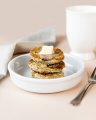 Syrniki, cottage cheese fritters or curd pancakes, made from curd and hemp flour. Low carb Ketogenic diet.