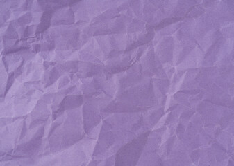 Wrinkled sheet of purple paper. Textured backdrop