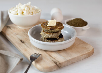Syrniki, cottage cheese fritters or curd pancakes, made from curd and hemp flour. Low carb Ketogenic diet.