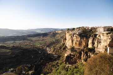 town of ronda at sunset over canyon
