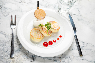 Cottage cheese pancakes with sour cream