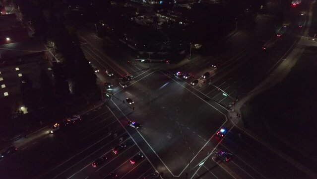 Police at Car Crash Intersection Night