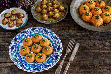 Desserts with syrup and pistachio on the table