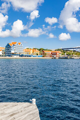 Fototapeta na wymiar Colorful buildings of the district Otrobanda in Willemstad, Curacao, viewed from the Queen-Emma-Bridge