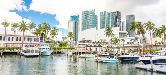 View of the Marina in Miami Bayside with modern buildings and skyline in the background.
