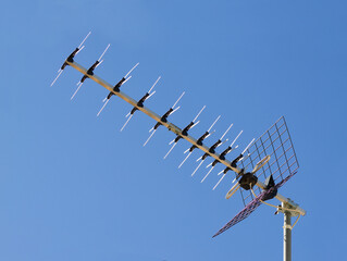 Outdoor amplified Yagi antenna with blue sky in the background