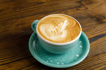 coffee with milk on a wooden table

