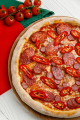 Italian pizza on a white wooden table
