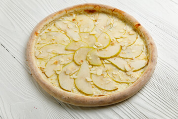 Italian pizza on a white wooden table
