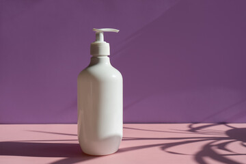 white cosmetic jars on a lilac-pink background with sun shadows. template for cosmetics.