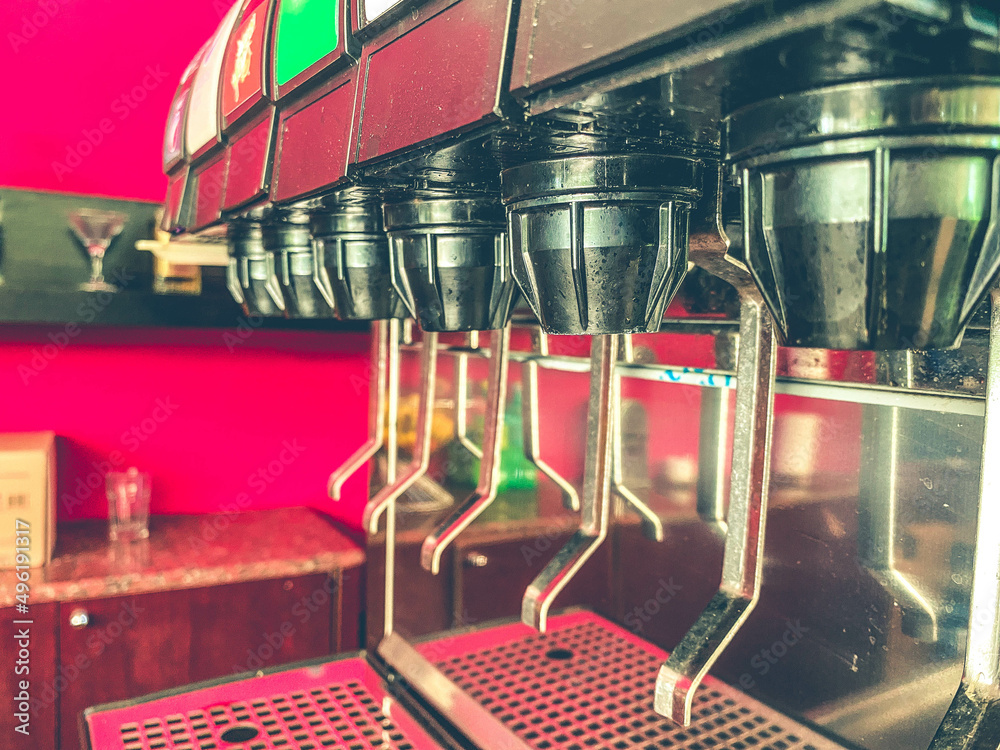 Wall mural selective focus at heart valve shape of juice dispenser on the table. / concept of refreshment and h