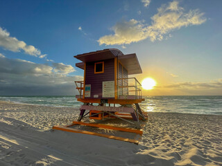 Iconic purple lifeguard house in Miami Beach. Beautiful sky at sunrise