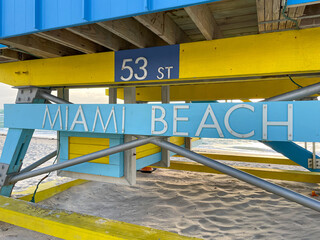 Iconic blue and yellow lifeguard house in Miami Beach. Beautiful sky at sunrise