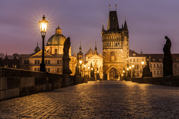 Fototapeta na wymiar Charles Bridge is the oldest standing bridge over the Vltava River in Prague and the second oldest preserved bridge in the Czech Republic. It is completed with three towers.