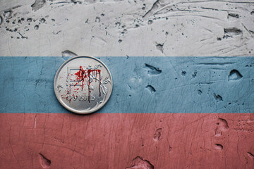 bloody Russian ruble on gray background, the war in Ukraine, the exchange rate of the ruble, the fall of the ruble