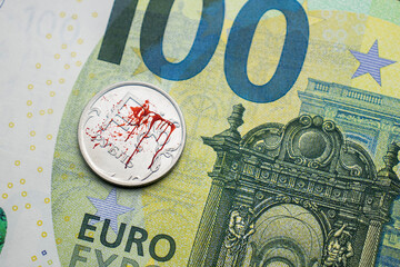 Fototapeta na wymiar bloody Russian ruble against the background of the euro, the war in Ukraine, the exchange rate of the ruble, the fall of the ruble