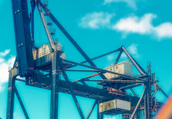 Aerial view over cargo cranes and ships in cargo port of Miami, Florida, USA.