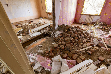Many bricks fell from a hole in the roof and walls of the house. Destroyed by an explosion...