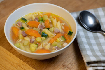 Fresh Vegetable soup and pasta in a white bowl