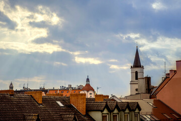 Poland, Zielona Góra 31.3.2022. Roofs of the old town of Zielona Góra. The rays of the sun shine on the tiled roofs of houses. 