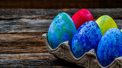 Painted easter eggs on wooden table