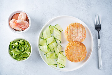 Shrimp patties with cucumber in a plate